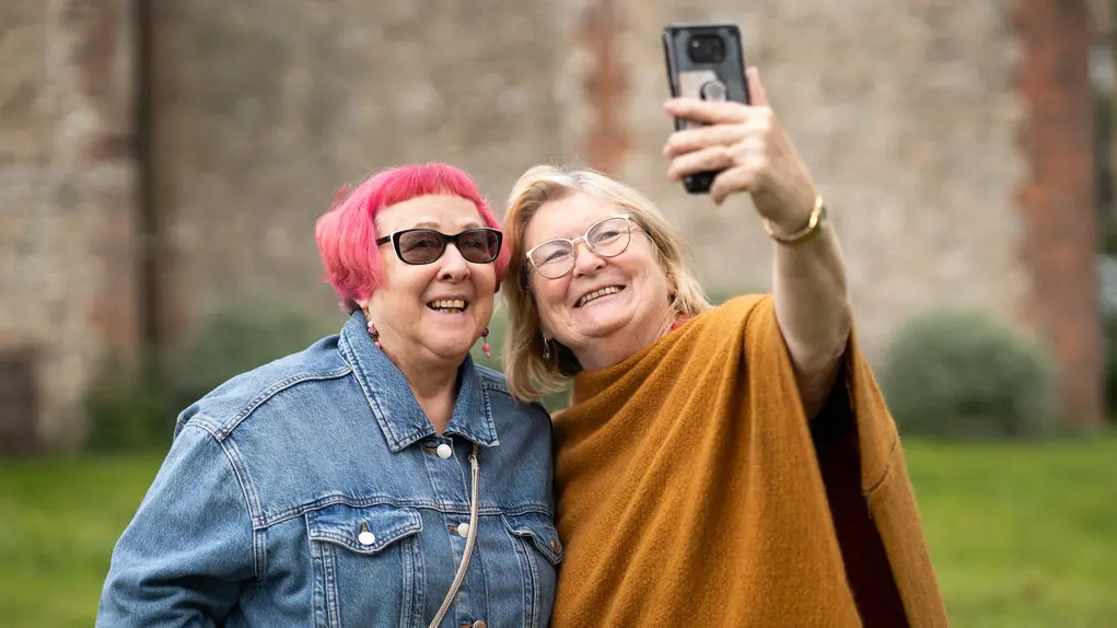 Two older women taking a selfie