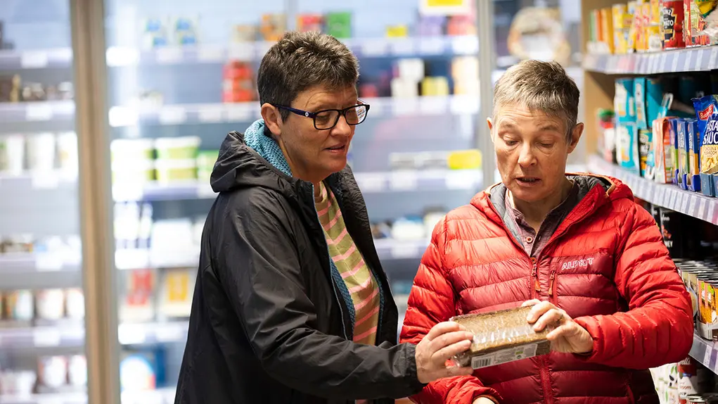 Two older women shopping