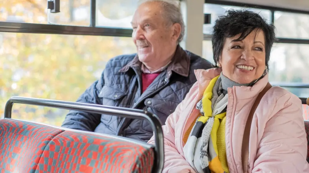An older couple on a bus