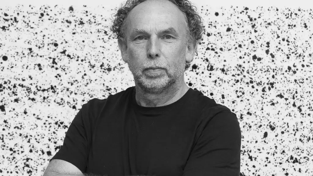A black and white image showing Richard, who wears a black t-shirt, looking at the camera.