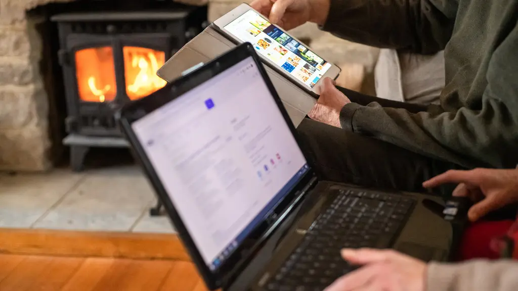 People out of frame using a laptop