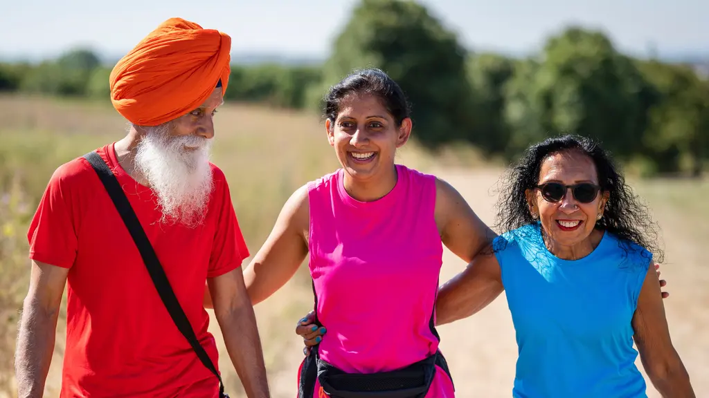 Family exercising outdoors with two older parents