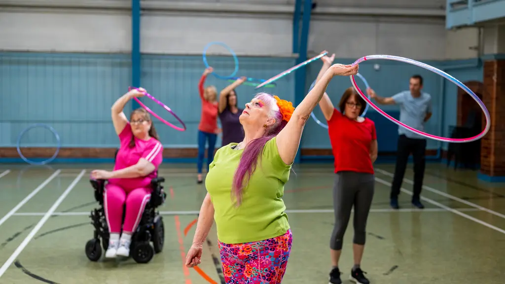 A group of older people using hoola hoops