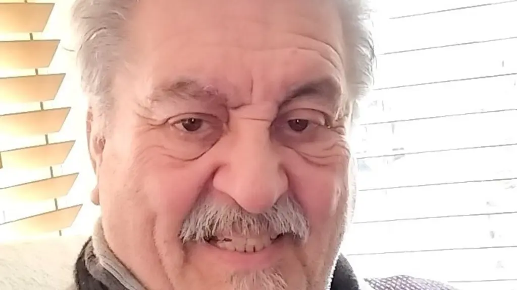 Photo of Paul with short white hair and beard