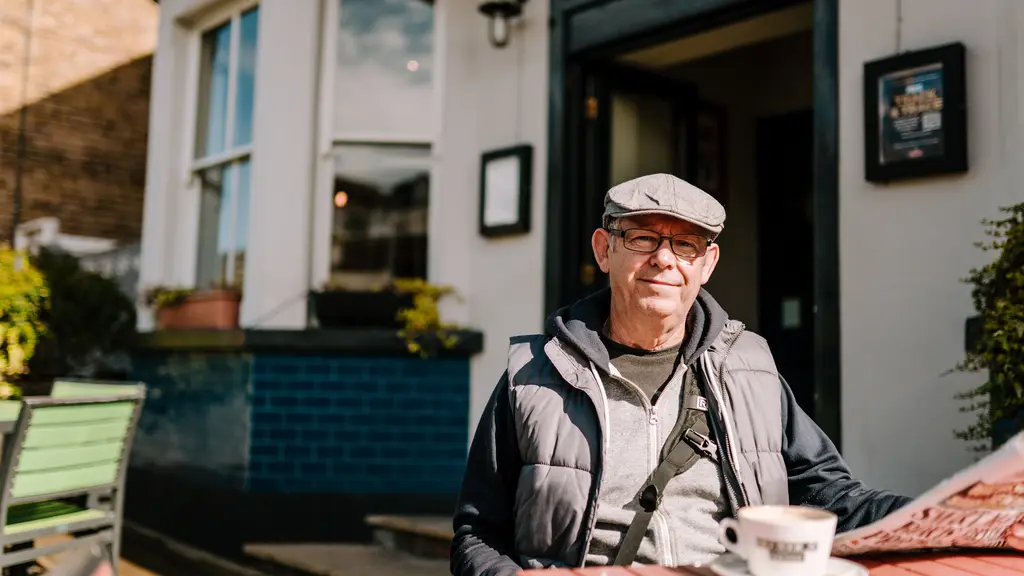 An older man enjoying a coffee