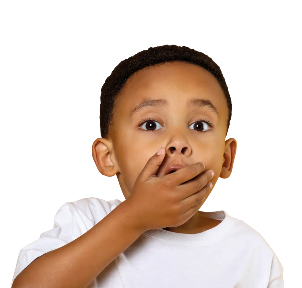 Young boy with shocked face and hand over his mouth